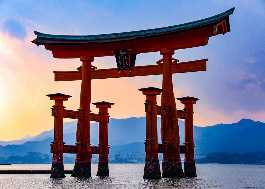 Sunrise over a a famous shrine attraction in a lake in southern Japan