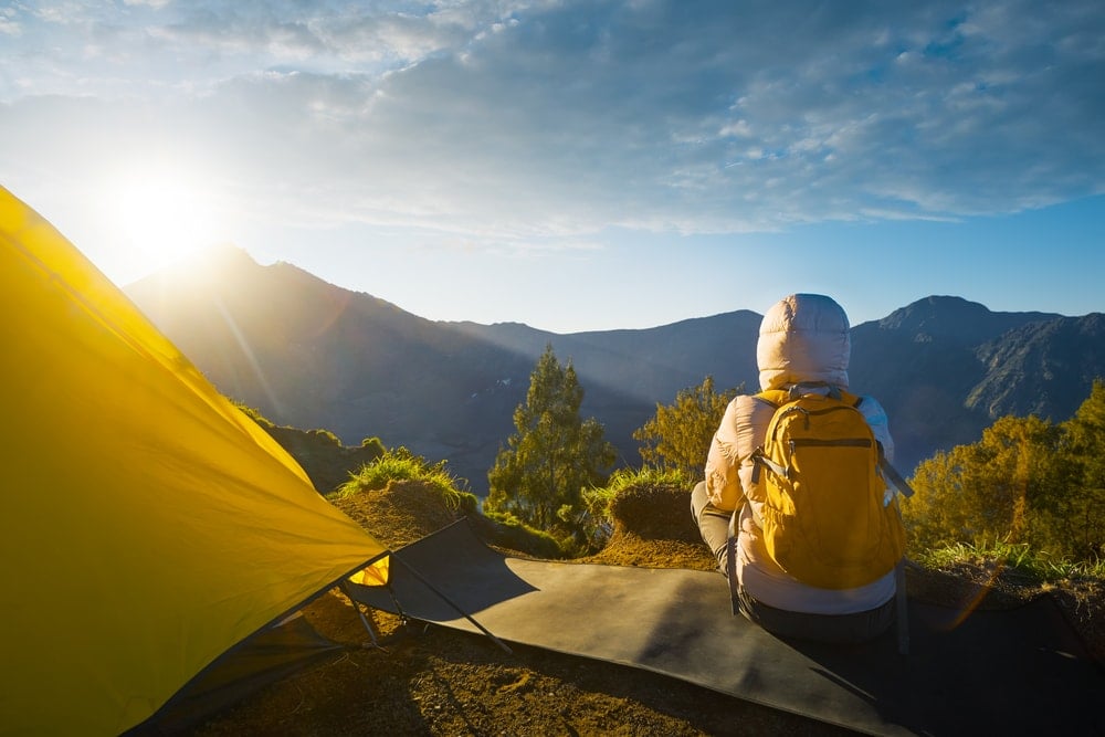 A person camping on a mountain in Kachin State, Myanmar