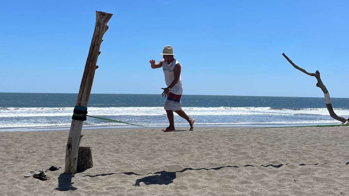 slackliner on the beach in nicaragua