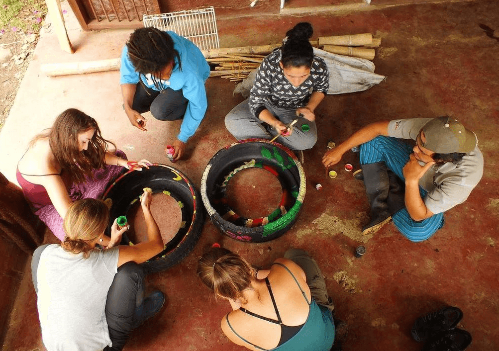 group of volunteers making something in a circle