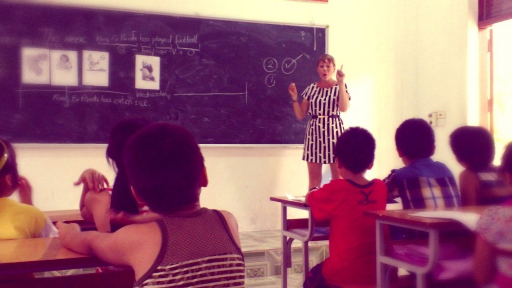 A teacher teaching English abroad