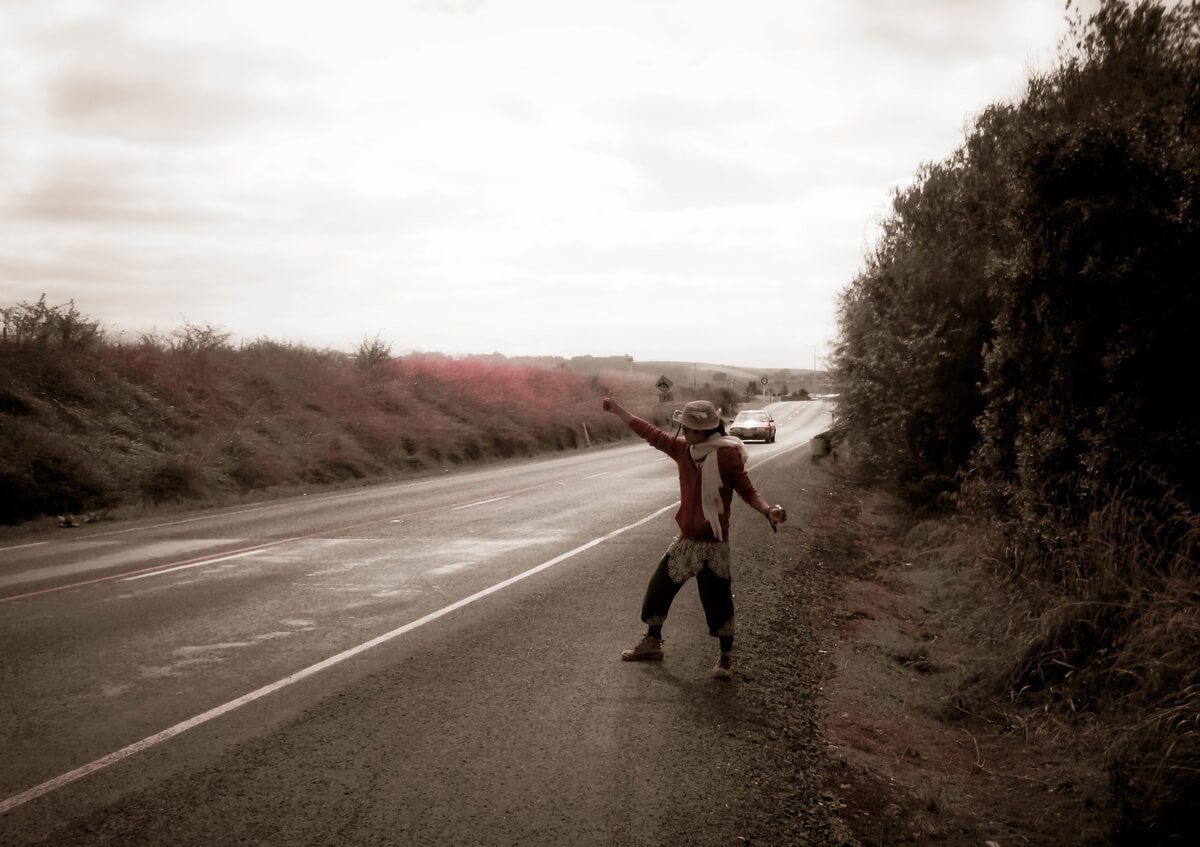 A backpacker in Byron Bay hitchhiking in the surrounding area