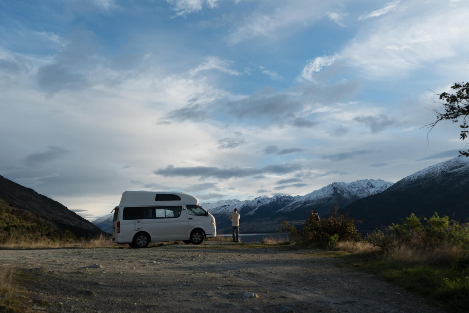 A man travelling the Otago region by campervan camping outside Queenstown