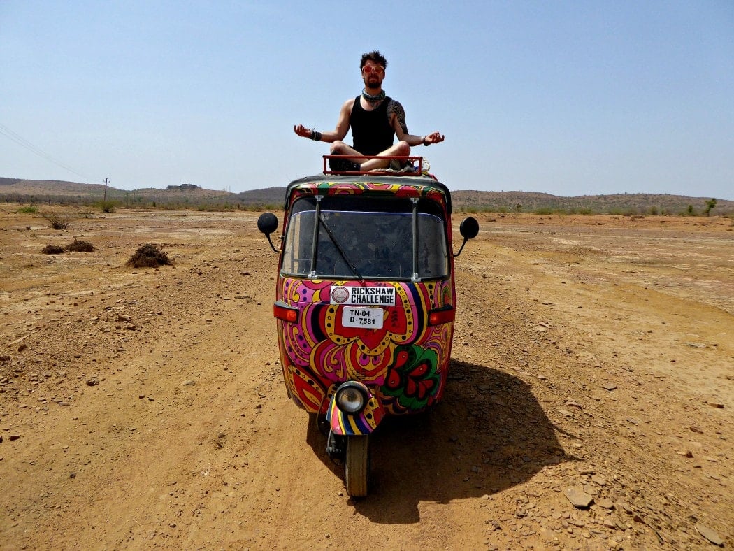 Driving a rickshaw while travelling in India