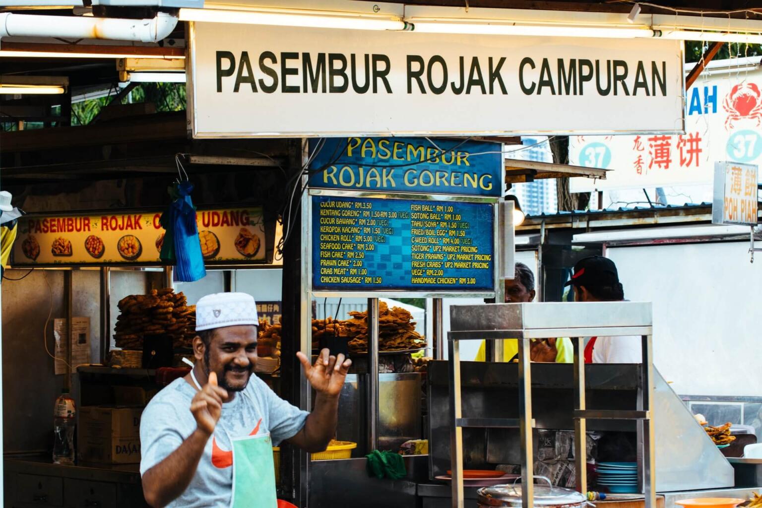 man at a street stall in malaysia