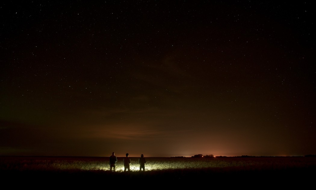 Group of people camping at night - top thing to do in Mauritius at night