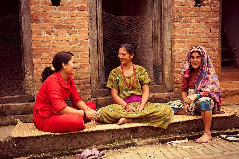 Nepalese women sitting in the street at a market