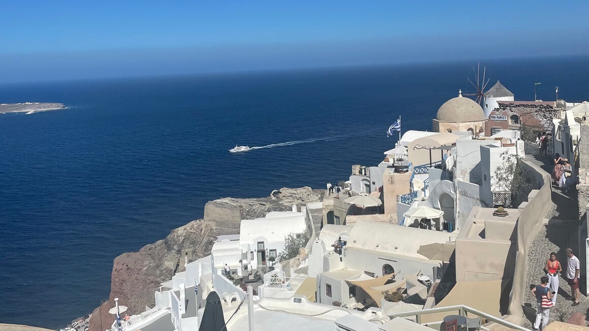 view over buildings and the sea in oia, santorini, greece