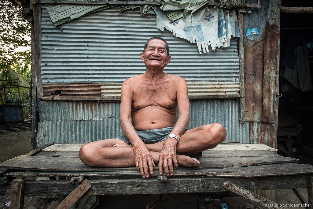 A smiling Khmer man meeting a backpacker in Cambodia