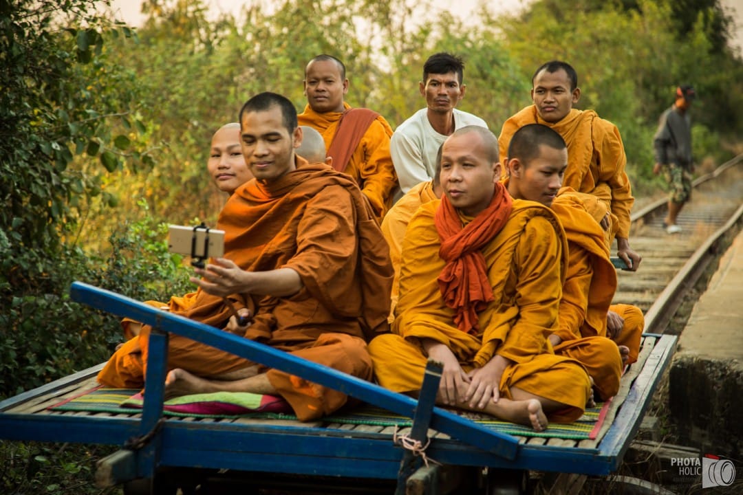 Monks on the bamboo train in Battambang