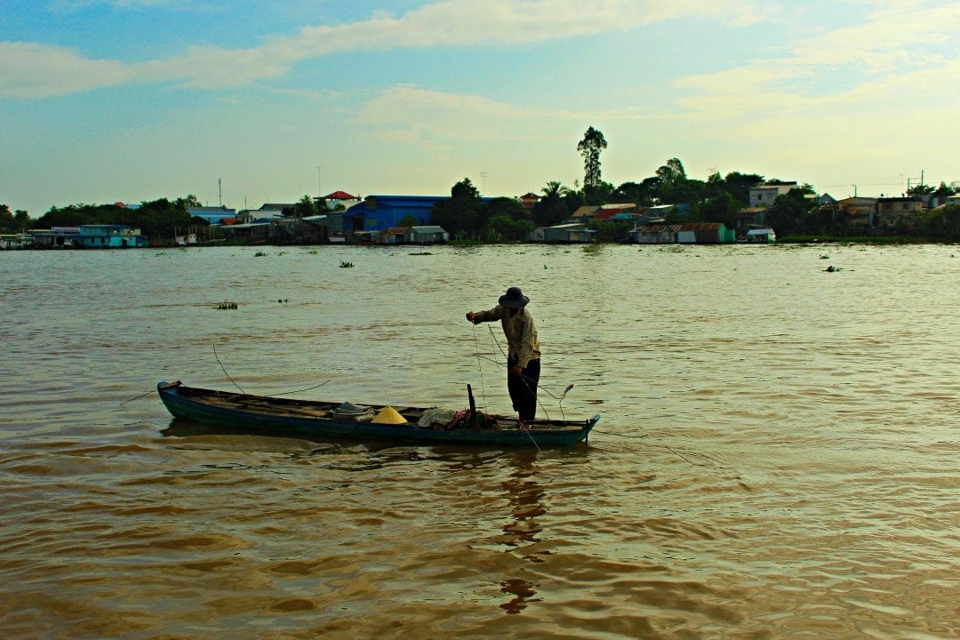 Man fishing in the Mekong River in Cambodia