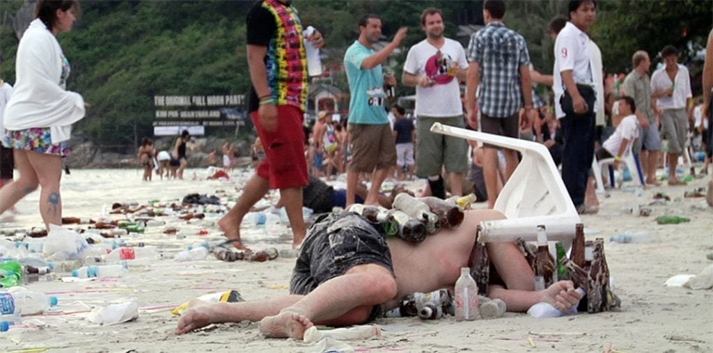 An unconscious man after a Full Moon Party in Thailand