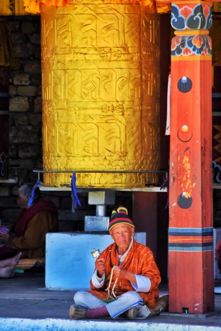 travel to Bhutan man praying