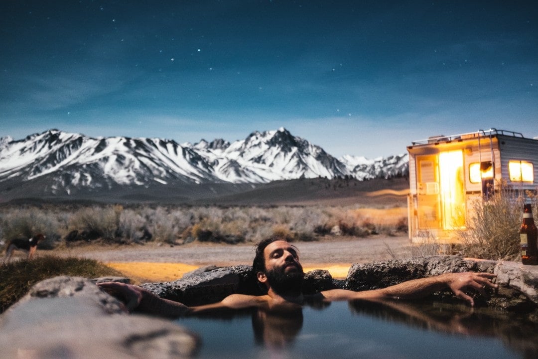 A man enjoying the hot spring thermal baths at Hanmer Springs in New Zealand