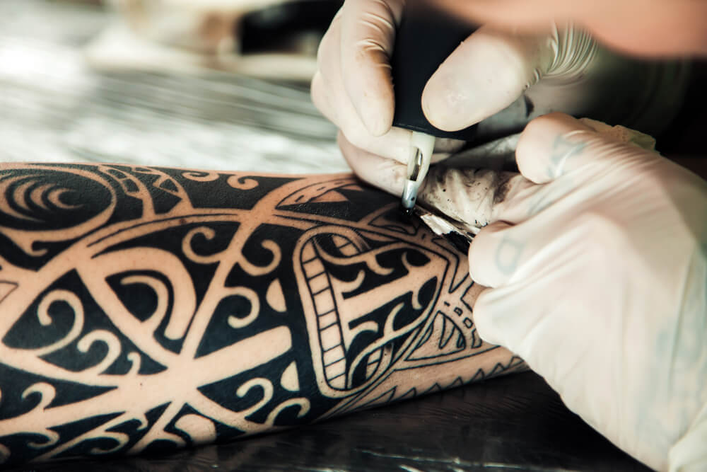 Recieving a Polynesian tattoo in Tahiti