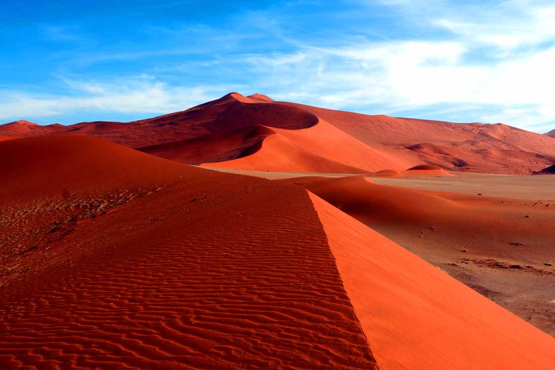 The amazing red sand dunes of Sossusvlei while backpacking Namibia