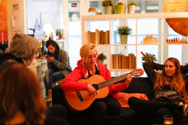 Best Party Hostel in Barcelona #4 - Hostel One Ramblas guest guitar jamming.