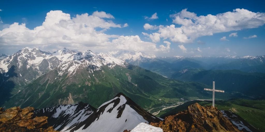 Cross at Summit of Mountain Svaneti cost of living in Georgia