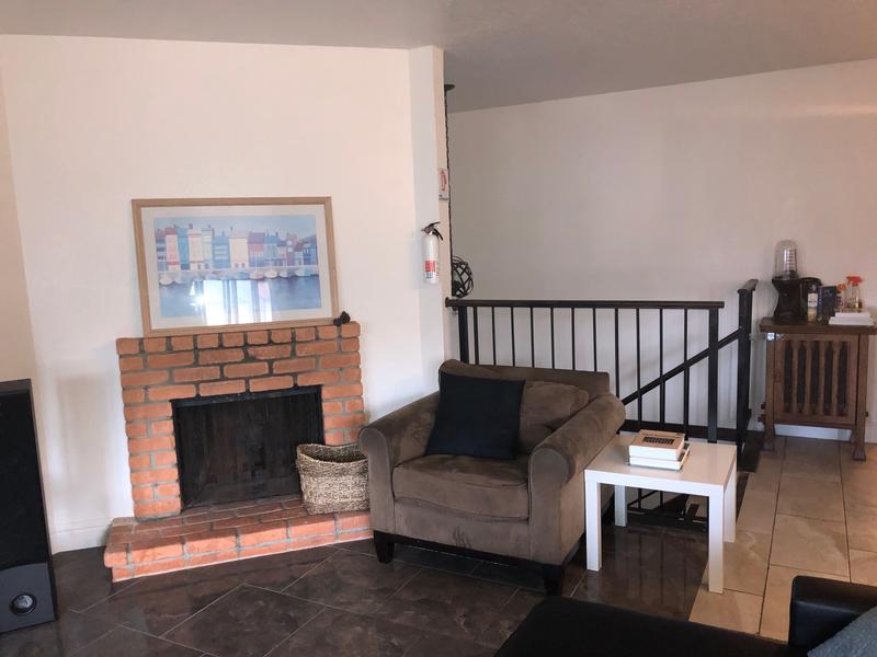 SFO Crashpad best hostels in San Francisco. Couch and fireplace in the shared lounge.