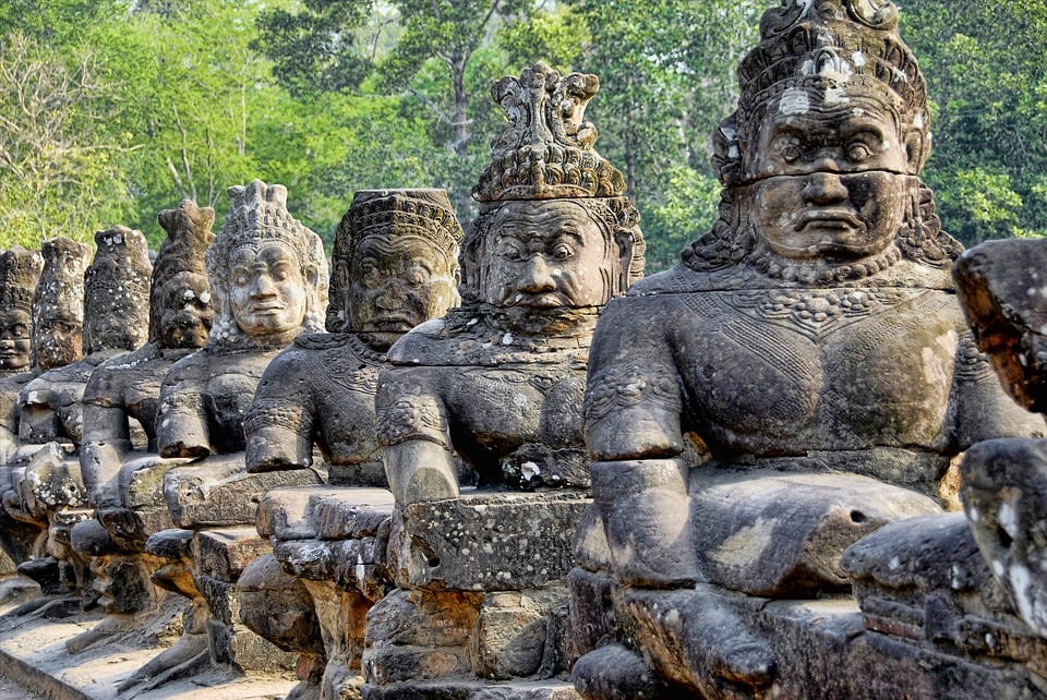 A row of ancient statues - historical site in Siem Reap