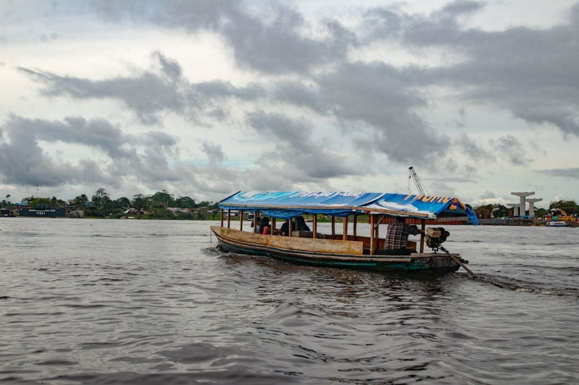 traveling by boat in the Amazon rainforest