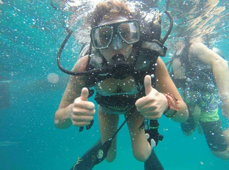 A woman scuba diving off the coast of Cairns, Australia