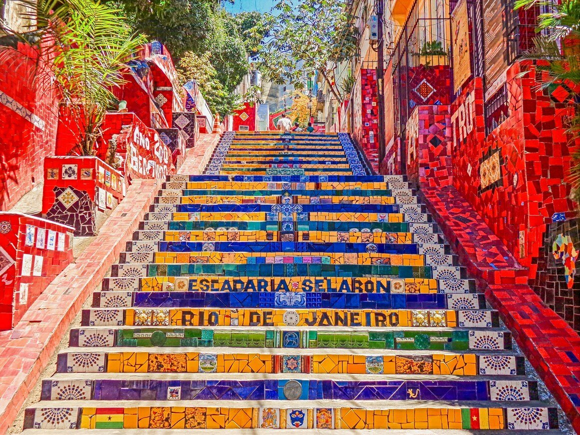 Colorful stairs made of mosaics in a neighborhood in Brazil seen from below.