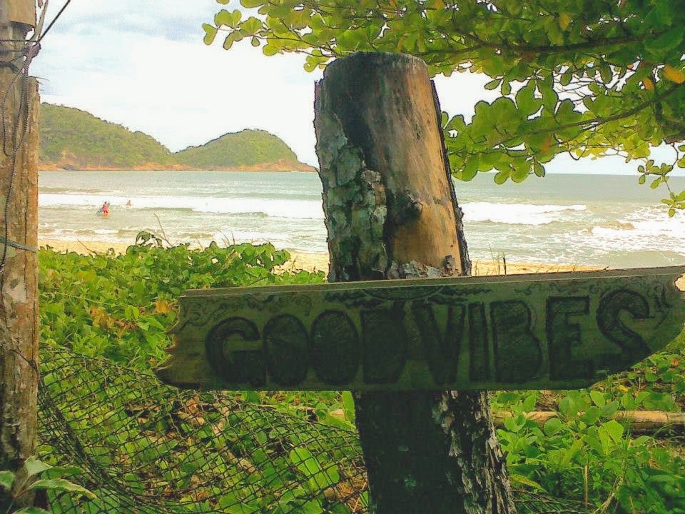Good Vibes word written on a piece of wood on a beach in Brazil.