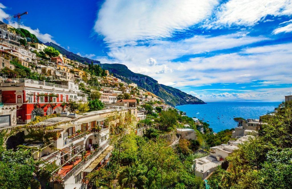 a village atop a cliff on the amalfi coast