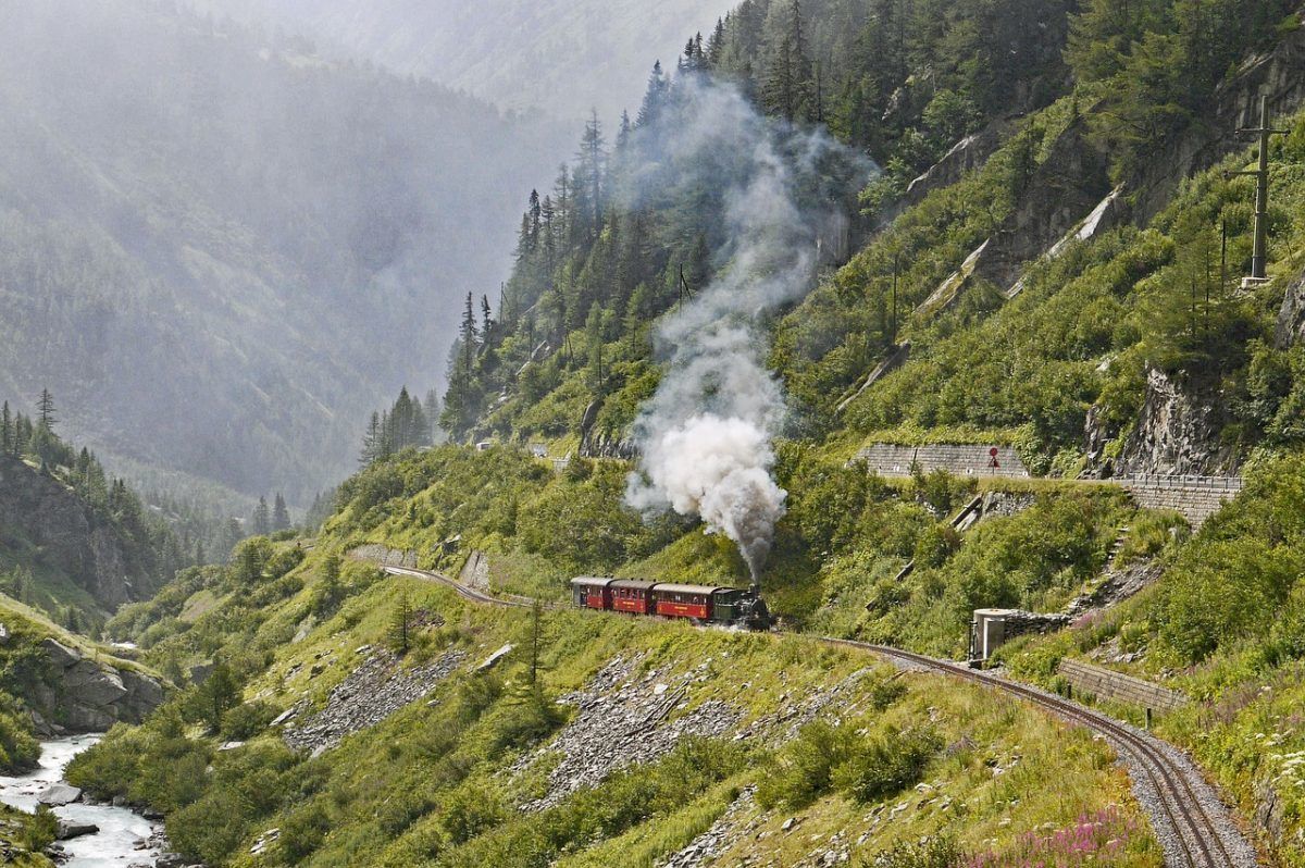 beautiful green hills viewed by train travel in europe