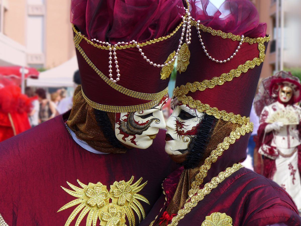 masked celebrators attending carnevale in venice italy