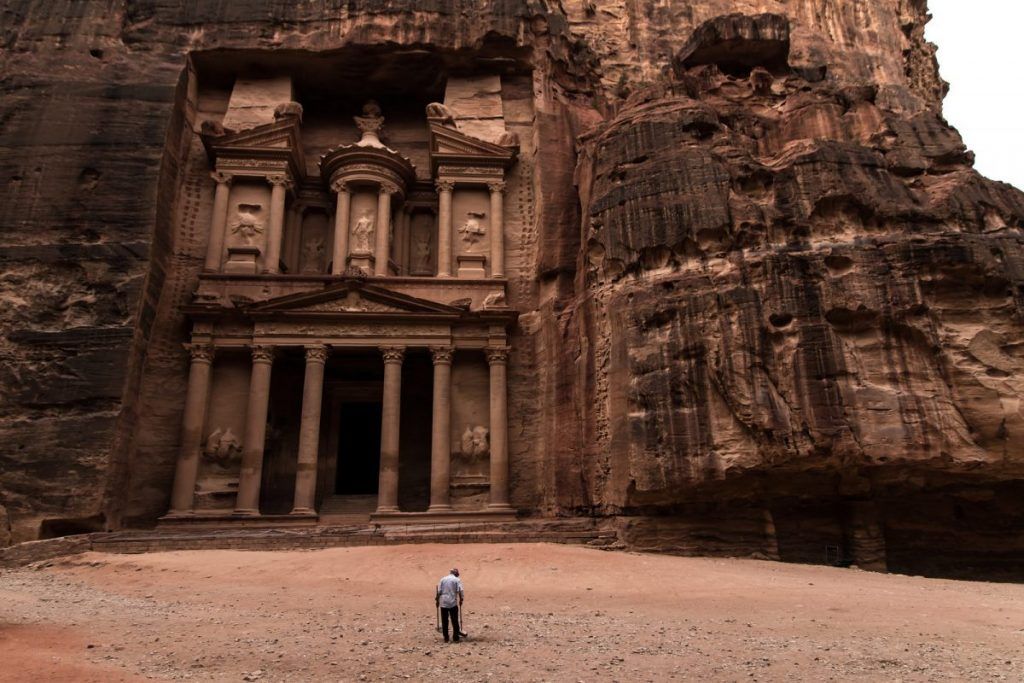 A man cleaning up in front of the Petra site - best place to go on a tour from Israel