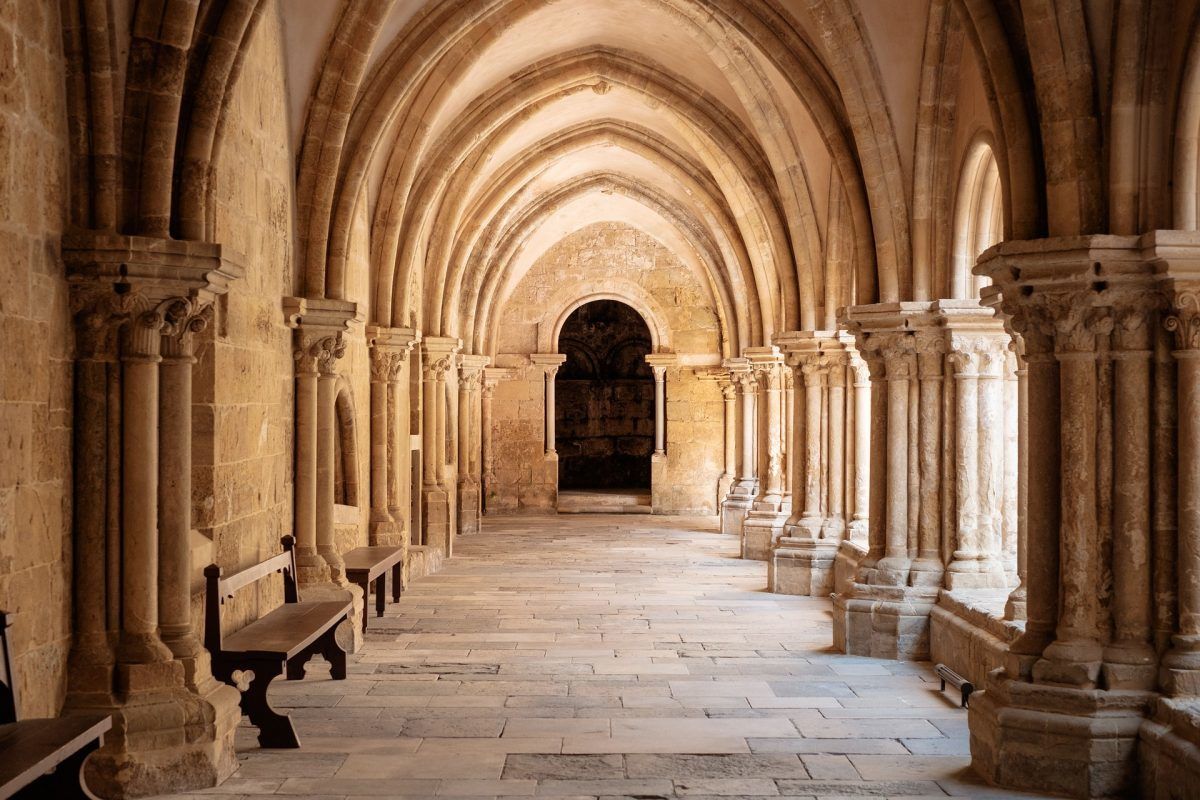 door at the end of pillared hallway portugal