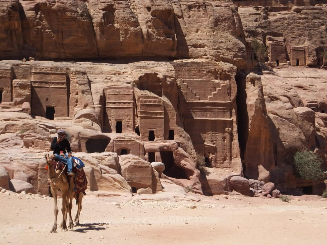 man on a donkey in petra jordan