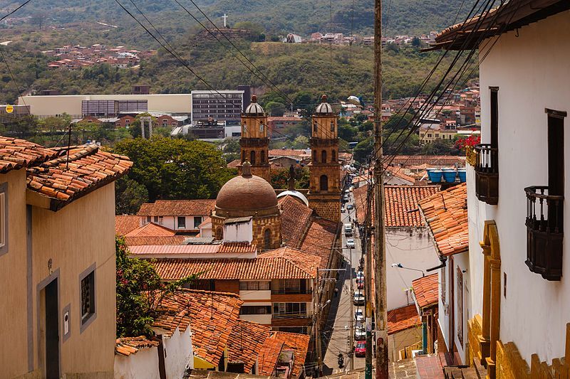 View of the city with red roofs of some local houses and some nature in the background in San Gil. 