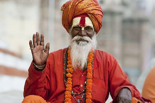 Indian Sadhu in Varanasi posing for a photo