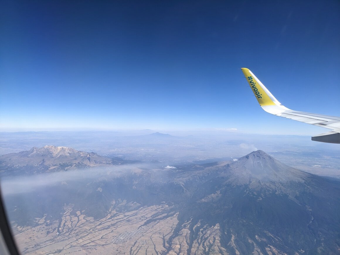View of Iztaccihuatl Mountain and Popocatepetl Volcano from the view of a plane