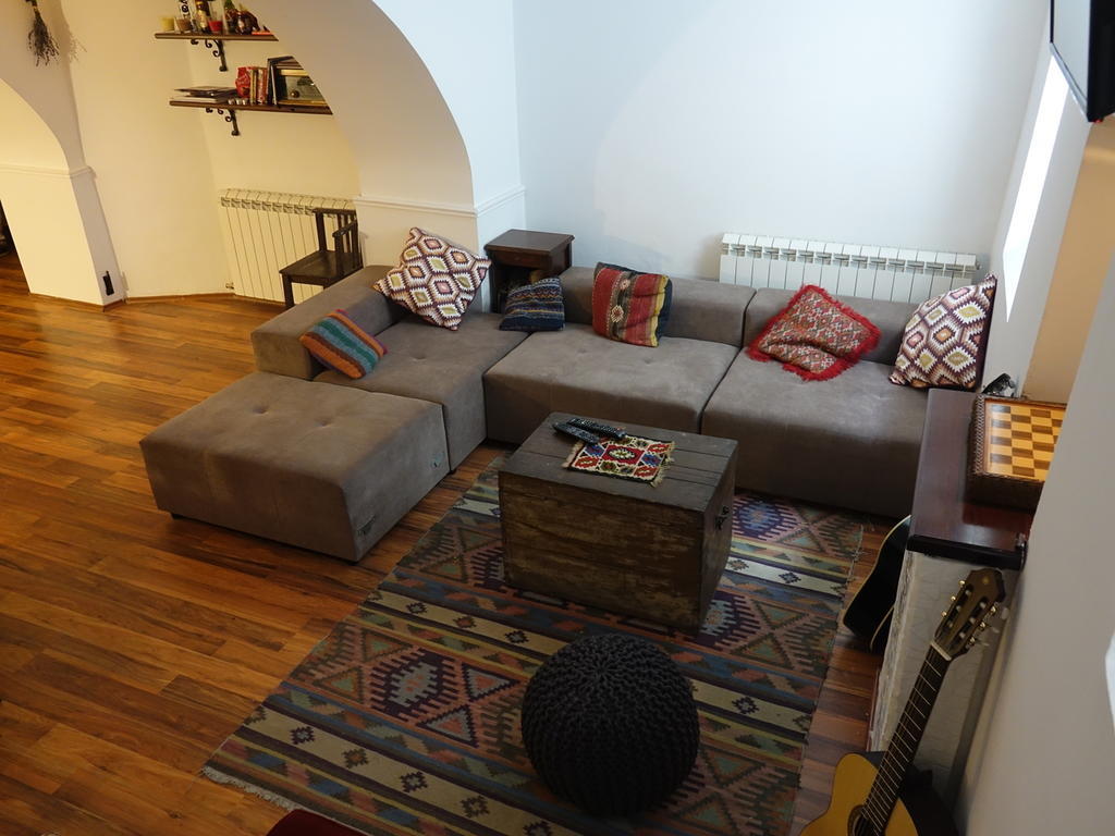 Balkan Soul Hostel best hostels in Belgrade. Soul Lounge communal area with a chess board and couch