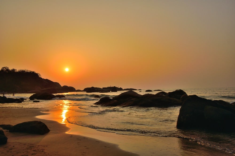 an firey orange sunset seen while staying in south goa