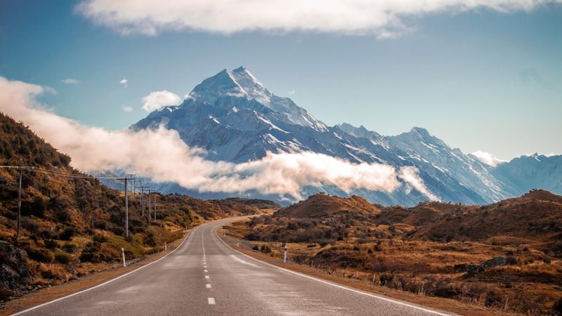 Mountains and a long straight road found while roadtripping new zealand. 