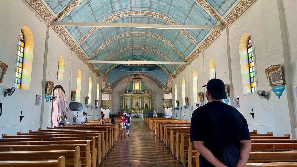 harvey walking through lazi church in siquijor philipinnes