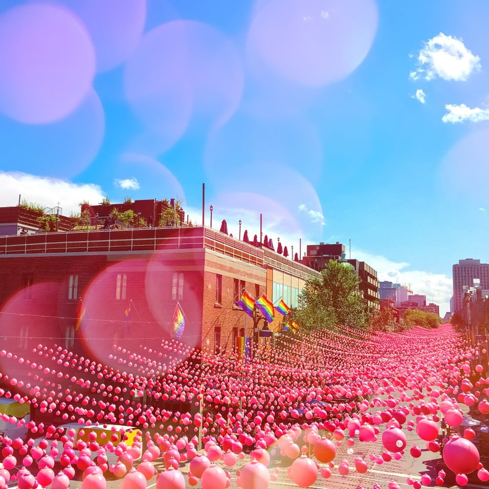 The Village, Montreal full of pink coloured bunting and rainbow flags