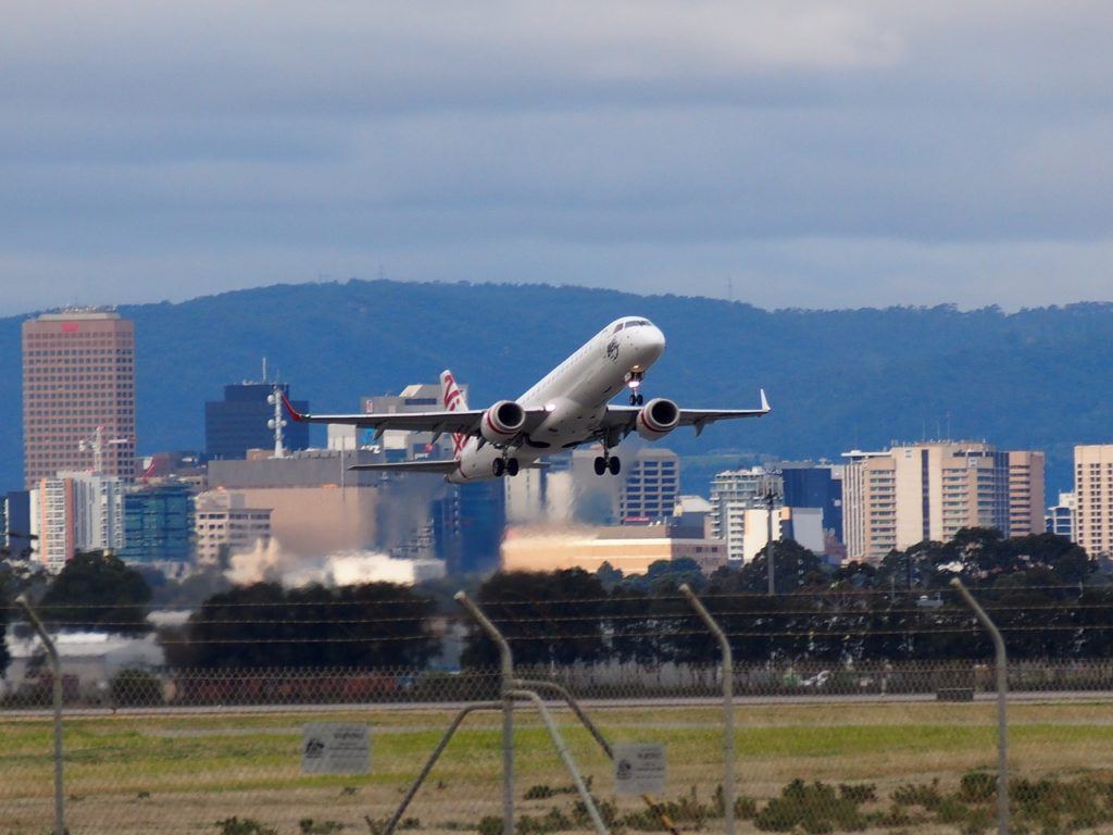 plain taking off adelaide international airport