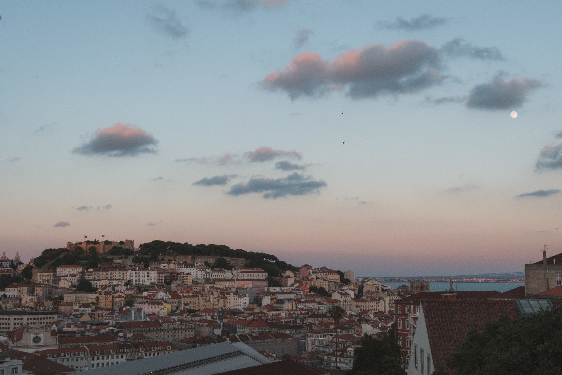 sunset and Jorge Castle from miradouro in Lisbon Portugal