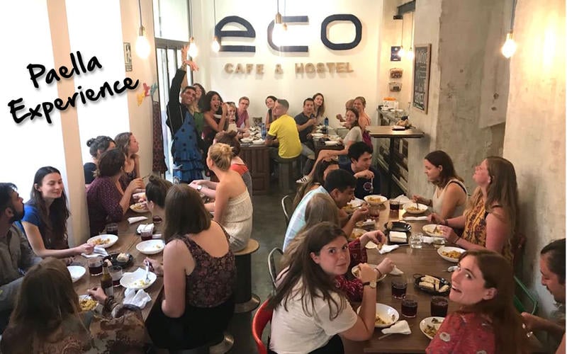 Eco Hostel best hostels in Granada, Spain, people eating paella in the communal area