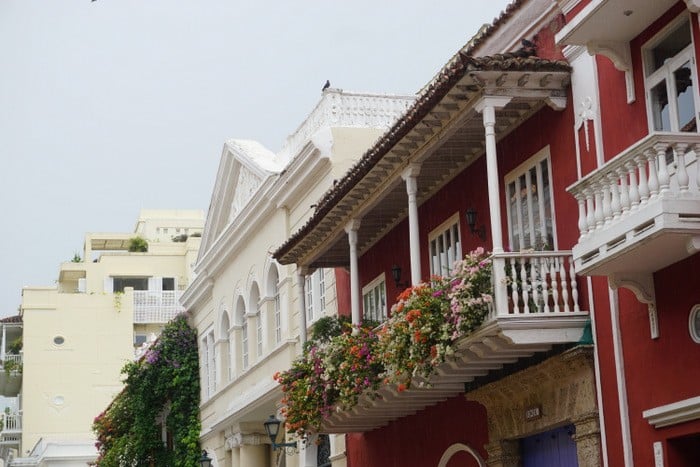 colorful buildings with flower-filled balconies in the Old City, Cartagena