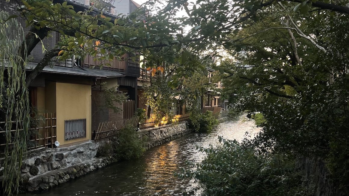 A river runs through the streets of Kyoto Japan.