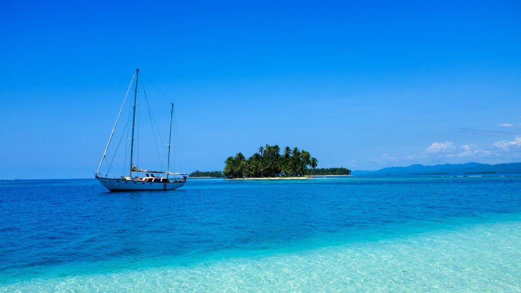 A sailboat anchored outside of a small island in the US Virgin Islands.