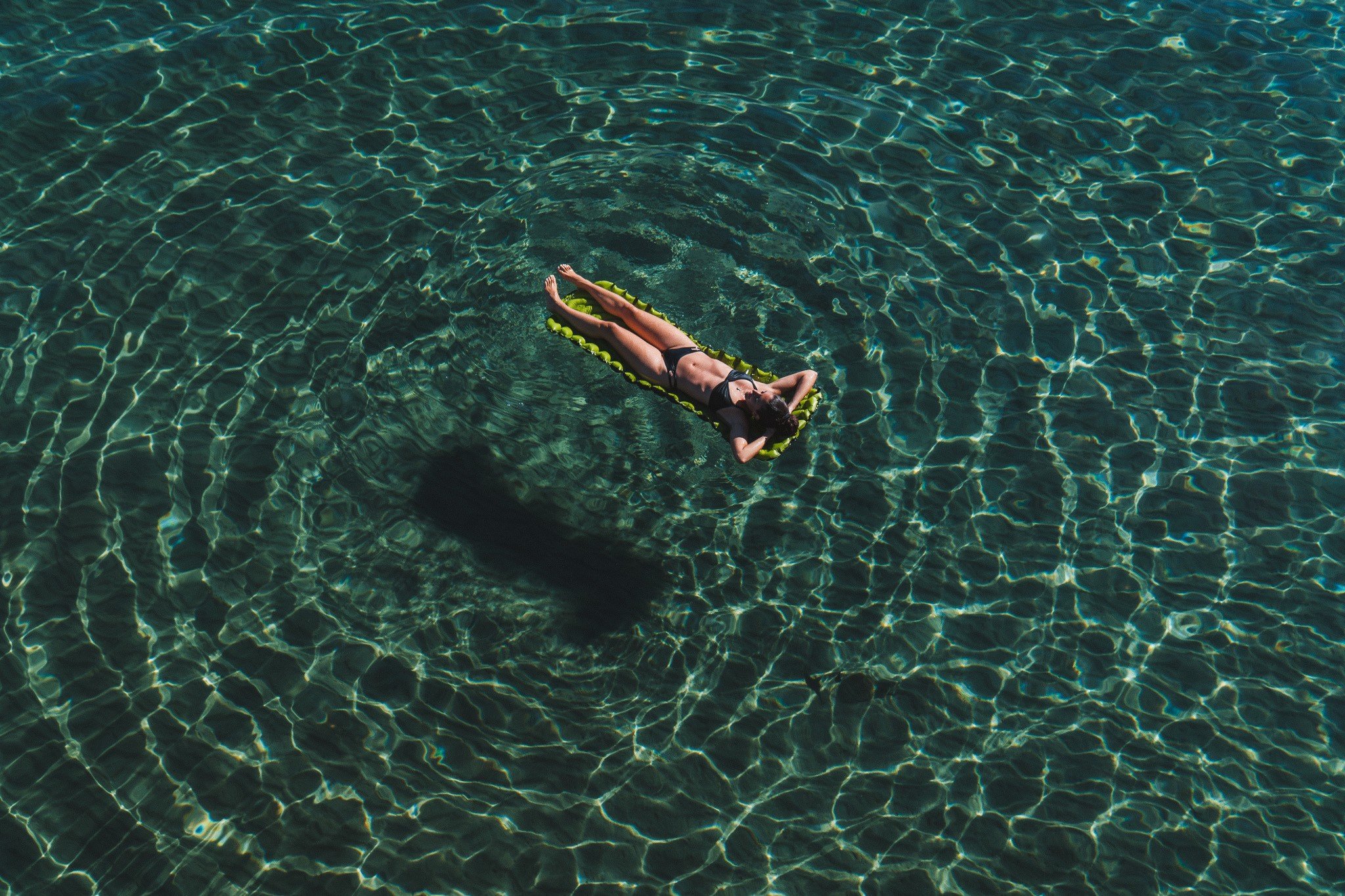 Sleeping pad floating in a pool