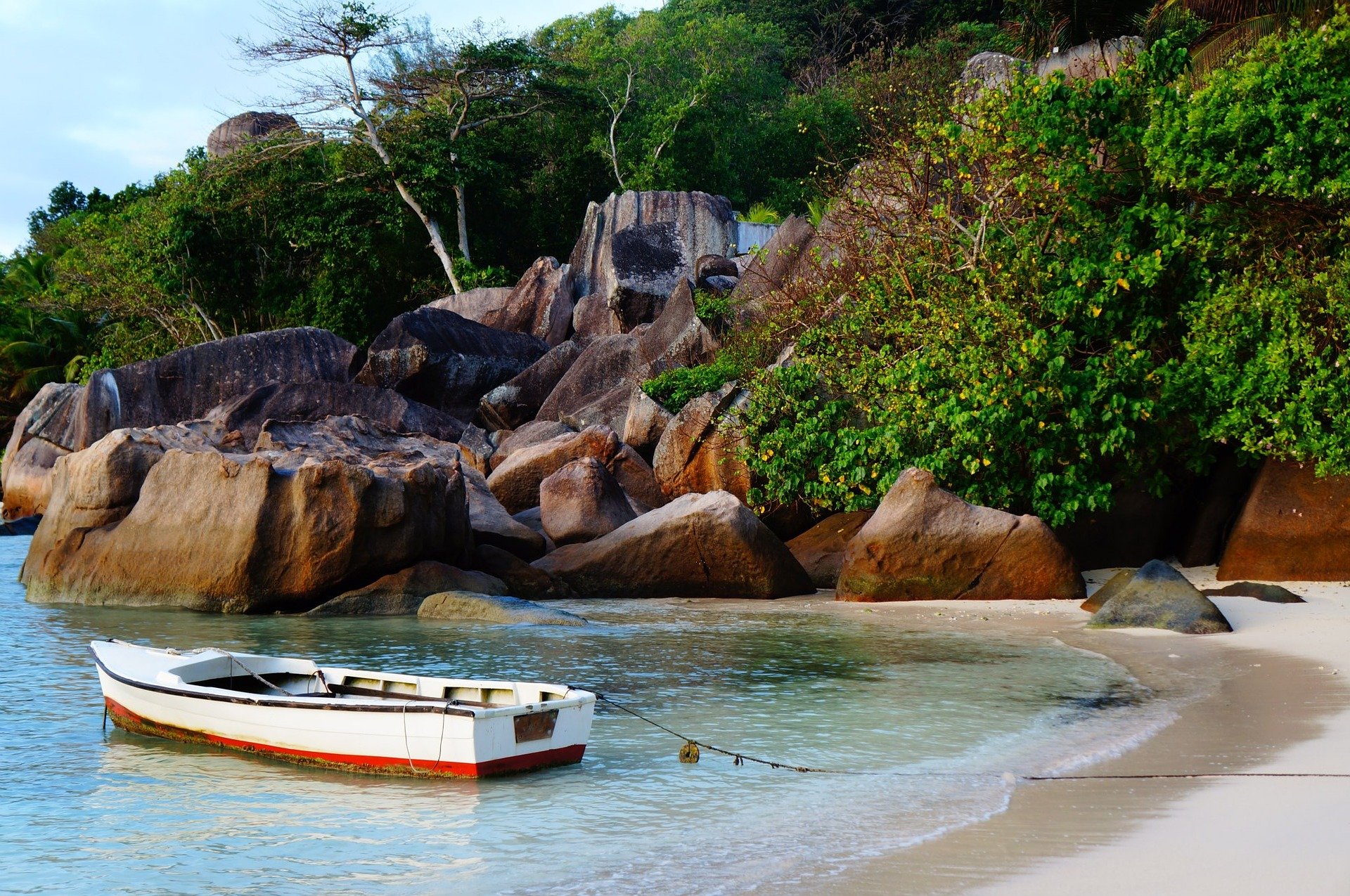 a sailboat docked on a Mahe beach whole staying in Seychelles
